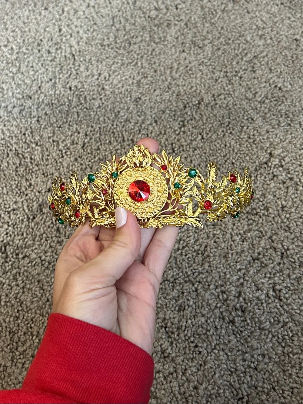 Gold colored crown headband with red and green faux gemstones
